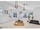 Bright kitchen featuring modern pendant lights, black sink and faucet with neutral decor at 778 Vegas Valley Dr, Las Vegas, NV 89109