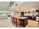 Spacious modern kitchen with stainless steel appliances, black cabinets, and a large center island with seating at 778 Vegas Valley Dr, Las Vegas, NV 89109