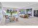 Open-concept space with dining area, living room, fireplace, and pool view through the sliding door at 778 Vegas Valley Dr, Las Vegas, NV 89109