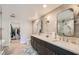 Elegant main bathroom with double vanity, modern lighting, and a walk-in closet at 778 Vegas Valley Dr, Las Vegas, NV 89109