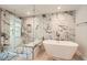 Elegant bathroom with a luxurious soaking tub, and glass enclosed shower with stylish marble wall at 778 Vegas Valley Dr, Las Vegas, NV 89109