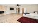 Expansive main bedroom with hardwood floors, modern fan, fireplace and access to an ensuite bathroom at 778 Vegas Valley Dr, Las Vegas, NV 89109