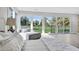 The main bedroom has golf course views, light wood floors, and a comfortable seating area at 778 Vegas Valley Dr, Las Vegas, NV 89109