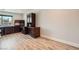Office with wood floors, a window, and a large desk with built-in storage at 778 Vegas Valley Dr, Las Vegas, NV 89109