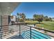 Balcony view of a sparkling pool and lush green golf course, offering a luxurious outdoor living experience at 778 Vegas Valley Dr, Las Vegas, NV 89109