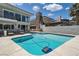 Backyard pool with a modern two story home and patio seating at 778 Vegas Valley Dr, Las Vegas, NV 89109