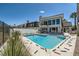 Beautiful swimming pool with clear blue water, surrounded by a patio and lush landscaping, near the rear of the property at 778 Vegas Valley Dr, Las Vegas, NV 89109