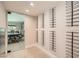 Stylish wine room with sleek metal wine racks, ready for your collection, adjacent to a modern office at 778 Vegas Valley Dr, Las Vegas, NV 89109