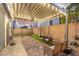 Backyard featuring a patio, artificial grass, and string lights at 8021 Adelaide Hills St, Las Vegas, NV 89113