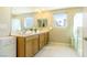 Bathroom featuring a double sink vanity, large mirror, and a glass-enclosed shower for a spa-like experience at 8021 Adelaide Hills St, Las Vegas, NV 89113