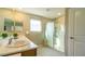 Bright bathroom features a double sink vanity and a glass-enclosed shower at 8021 Adelaide Hills St, Las Vegas, NV 89113