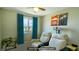 Digitally staged media room features two recliners, a projector, and movie-themed decor at 8021 Adelaide Hills St, Las Vegas, NV 89113