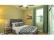Digitally staged bedroom featuring a comfortable bed, soft lighting, and stylish decor at 8021 Adelaide Hills St, Las Vegas, NV 89113