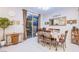Bright dining area with sliding glass door, modern lighting, and seamless transition into the kitchen at 8021 Adelaide Hills St, Las Vegas, NV 89113