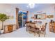 Bright dining area with sliding glass door, modern lighting, and seamless transition into the kitchen at 8021 Adelaide Hills St, Las Vegas, NV 89113