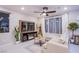 Stylish living room with a media center, contemporary furnishings, and a light-filled atmosphere at 8021 Adelaide Hills St, Las Vegas, NV 89113