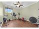 Bonus room with ceiling fan, hardwood floors and exercise equipment at 8405 Canyon Crevasse St, Las Vegas, NV 89166