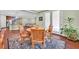 Dining room with wood floors and an adjacent kitchen and living room at 8405 Canyon Crevasse St, Las Vegas, NV 89166