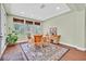Inviting dining area with wood floors, natural light, and traditional furnishings at 8405 Canyon Crevasse St, Las Vegas, NV 89166
