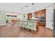 Open concept kitchen featuring a center island with barstool seating, and a dining area at 8405 Canyon Crevasse St, Las Vegas, NV 89166
