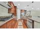 Modern kitchen with stainless steel appliances, gas cooktop, and granite countertops at 8405 Canyon Crevasse St, Las Vegas, NV 89166