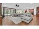 Open floor plan combining the living room and kitchen with sliding glass doors to the backyard at 8405 Canyon Crevasse St, Las Vegas, NV 89166