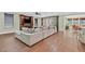 Spacious living room with a large comfortable sofa, fireplace, and access to the backyard at 8405 Canyon Crevasse St, Las Vegas, NV 89166