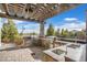 This home has a luxurious outdoor kitchen with stone counters and high-end appliances at 8405 Canyon Crevasse St, Las Vegas, NV 89166
