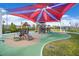 Community playground with slides, play structures, and colorful shade covers for outdoor fun at 8405 Canyon Crevasse St, Las Vegas, NV 89166