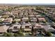 Panoramic aerial showing suburban development with pools and solar panels at 8547 Benidorm Ave, Las Vegas, NV 89178