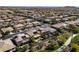 Aerial view showcasing homes with pools in a sprawling suburban neighborhood at 8547 Benidorm Ave, Las Vegas, NV 89178