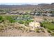 Aerial view of a lush park with playground, open space, and picnic tables in a housing community at 8547 Benidorm Ave, Las Vegas, NV 89178