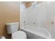 Full bathroom with white tiling around the tub at 8547 Benidorm Ave, Las Vegas, NV 89178