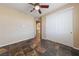 Bedroom featuring tile floors, ceiling fan, closet, and view of hallway at 8547 Benidorm Ave, Las Vegas, NV 89178