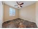 Bedroom featuring tile floors, ceiling fan, window with natural light, and closet at 8547 Benidorm Ave, Las Vegas, NV 89178