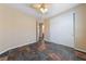 Bedroom with tile floors, ceiling fan, closet, and view of adjoining bathroom at 8547 Benidorm Ave, Las Vegas, NV 89178
