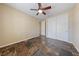 Bedroom with tile floors, ceiling fan, closet, and view of hallway at 8547 Benidorm Ave, Las Vegas, NV 89178