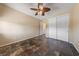 Bedroom featuring tile floors, neutral walls, ceiling fan, and closet space at 8547 Benidorm Ave, Las Vegas, NV 89178