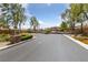 Community entrance featuring a security gate and manicured landscaping at 8547 Benidorm Ave, Las Vegas, NV 89178