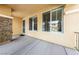 Welcoming covered front porch with stone pillar, offering a charming entrance to the home at 8547 Benidorm Ave, Las Vegas, NV 89178