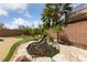 Lush backyard oasis featuring a serene koi pond with a waterfall and mature tropical landscaping at 8547 Benidorm Ave, Las Vegas, NV 89178