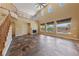 Bright living room with fireplace, soaring ceilings, and large windows overlooking the pool at 8547 Benidorm Ave, Las Vegas, NV 89178