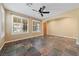Spacious living room with large windows, plantation shutters, and tile floors at 8547 Benidorm Ave, Las Vegas, NV 89178