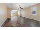 Open living space features neutral paint, ceiling fan, and large format tile flooring at 8547 Benidorm Ave, Las Vegas, NV 89178
