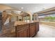 Open living area with island, backyard access, and view of second story and staircase at 8547 Benidorm Ave, Las Vegas, NV 89178