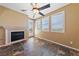 Inviting living room offers a fireplace, large windows, and tile flooring at 8547 Benidorm Ave, Las Vegas, NV 89178