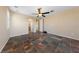 Neutral living space featuring a ceiling fan, expansive tile flooring, and plenty of natural light at 8547 Benidorm Ave, Las Vegas, NV 89178