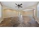 Spacious living room features tile flooring, neutral colored walls and ceiling fan at 8547 Benidorm Ave, Las Vegas, NV 89178