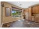 Home office with built-in desk, cabinets, tile floors, and a window view at 8547 Benidorm Ave, Las Vegas, NV 89178