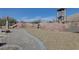 Rock themed playground with climbing structure and slide, perfect for outdoor activities at 8547 Benidorm Ave, Las Vegas, NV 89178
